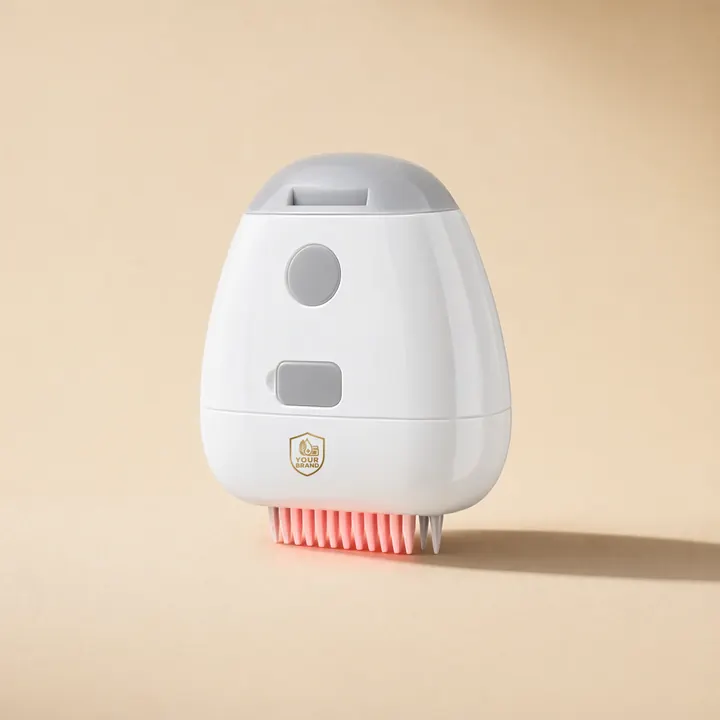 White powered scalp applicator with grey controls, pink comb teeth and a small YOUR BRAND shield, on warm sand